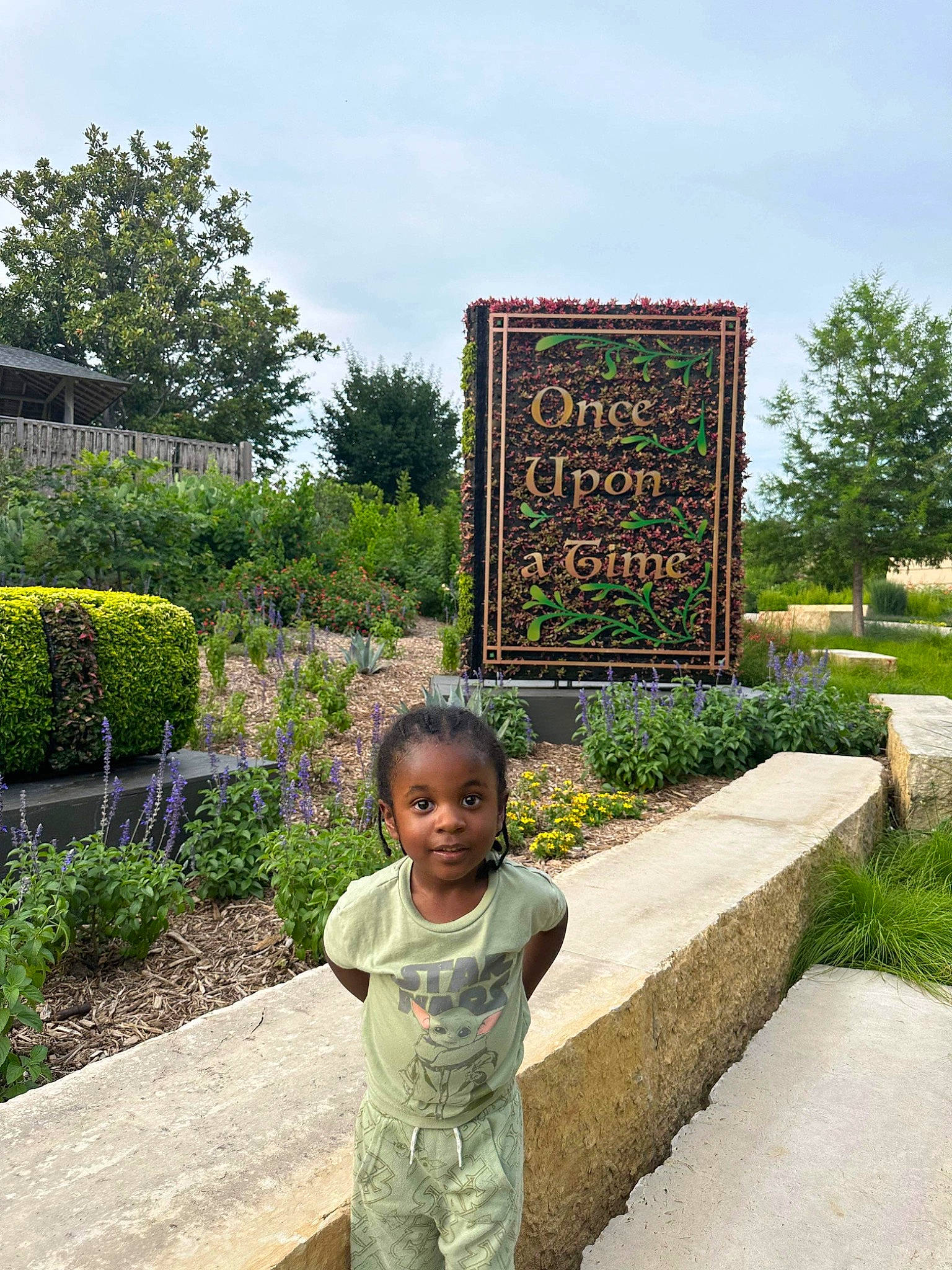 Mario joined the competition — help win amazing prizes! face, garden, grass, green, groundcover, happy, landmark, landscape, landscaping, leisure, natural_landscape, person, plant, road, shrub, signage, sky, t_shirt, toddler, travel