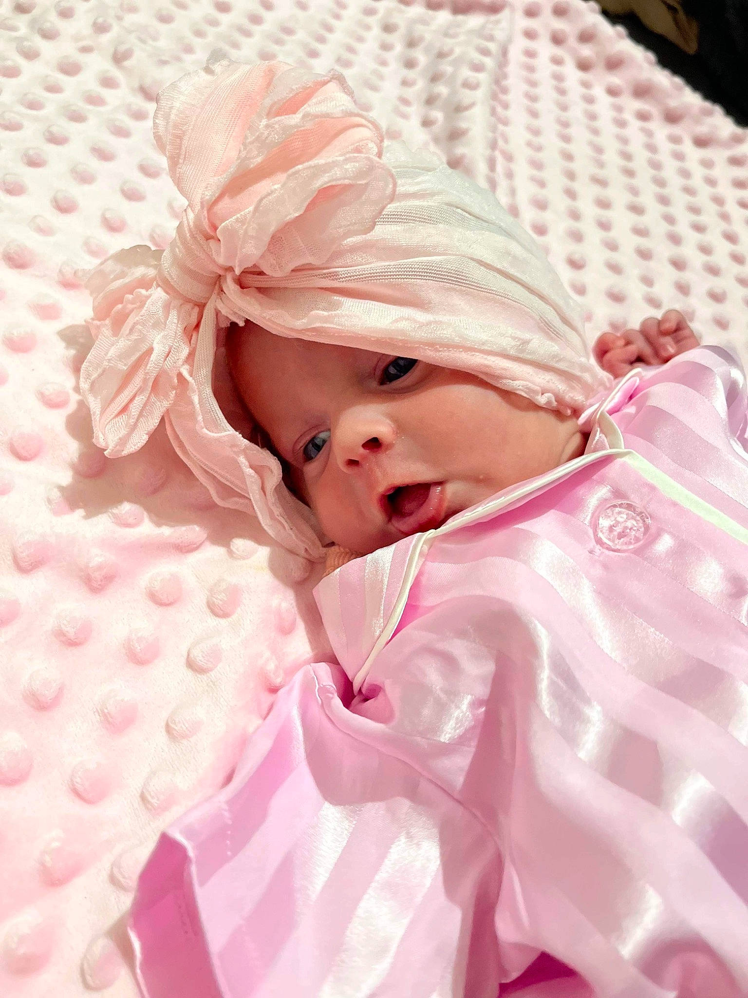 Aylah joined the competition — help win amazing prizes! baby, baby_sleeping, baby_toddler_clothing, child, comfort, embellishment, event, face, fashion_accessory, fur, hair_accessory, happy, linens, magenta, peach, person, petal, pink, skin, sleeve