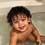 toddler, child, bath, bathtub, water, curly_hair, smiling, happy, playing, toy, skin, indoors, cute, sitting, young_child, person, bathroom, wet, fun, childhood