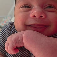 Eiden joined the competition — help win amazing prizes! baby, infant, newborn, close_up, smiling, face, hand, tiny_fingers, onesie, striped_clothing, cheek, nose, mouth, eyes, dimple, skin, portrait, indoors, cuddle, family