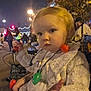 toddler, child, nighttime, outdoor, festival, lights, street, people, costume, sparkly_clothing, necklace, holiday, curious, portrait, winter, festive, crowd, trees, urban, celebration