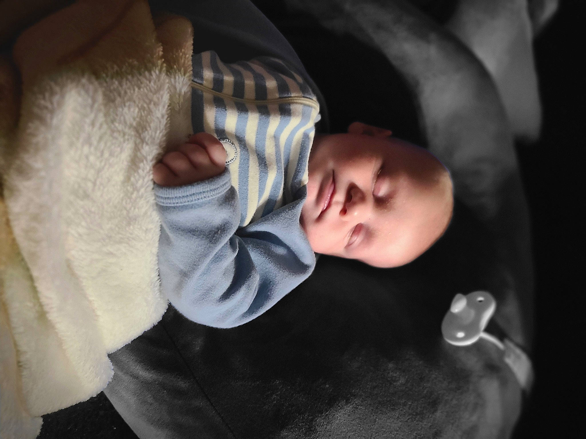 Brycen is registered to the contest to win money with this photo: baby, cheek, child, comfort, darkness, ear, elbow, eyelash, flash_photography, fur, gesture, hand, nap, nose, person, portrait_photography, room, sitting, sleep, toddler