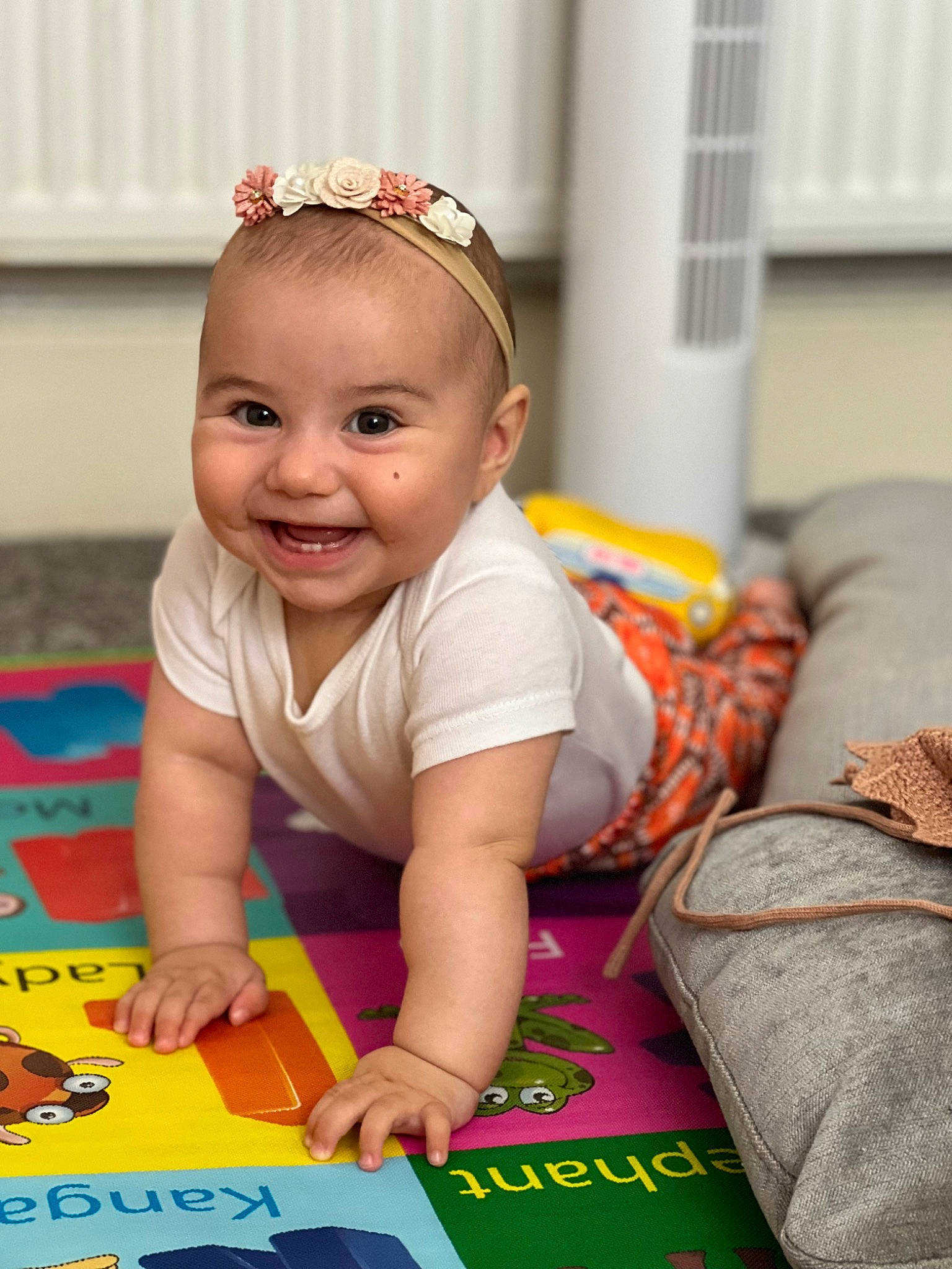 Alice joined the competition — help win amazing prizes! baby, baby_playing_with_toys, baby_toddler_clothing, child, face, fashion_accessory, flooring, fun, grass, happy, headband, headpiece, joy, leisure, pattern, person, play, room, sitting, skin