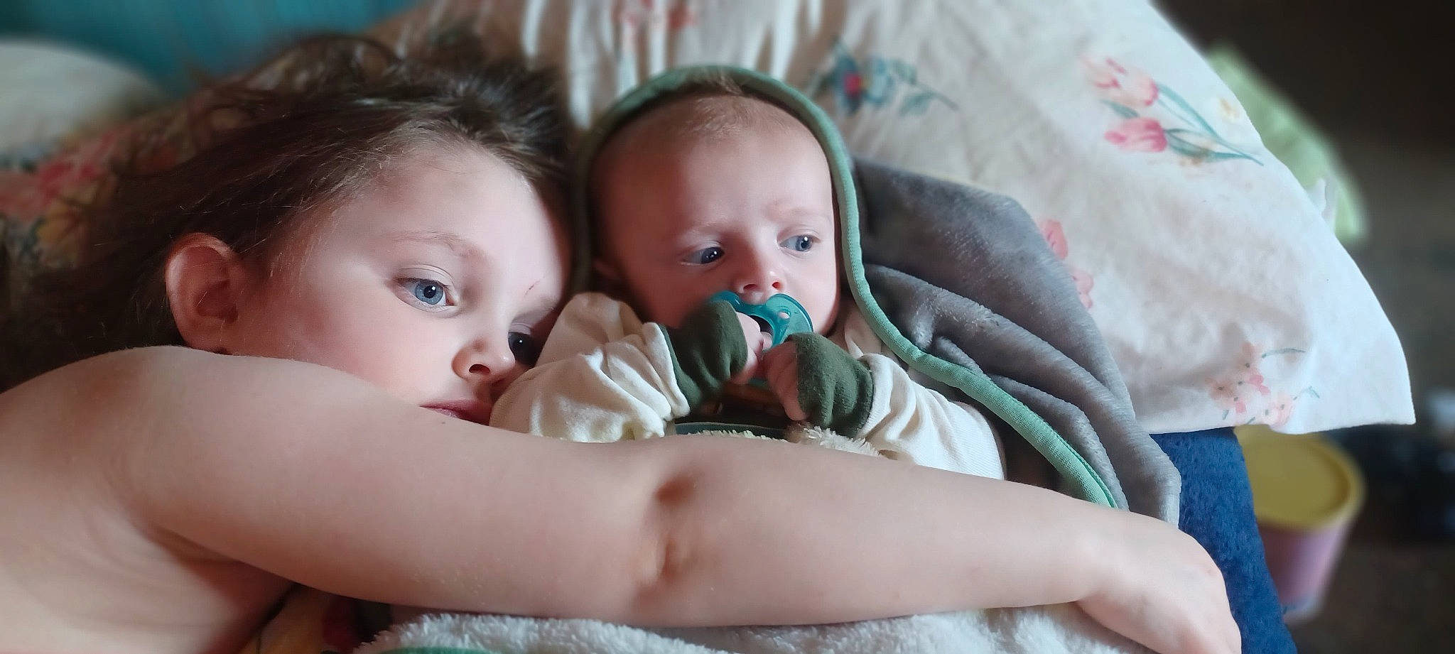 Julian is registered to the contest to win money with this photo: baby, baby_products, baby_toddler_clothing, bedding, bedtime, cheek, child, comfort, eye, eyebrow, happy, iris, linens, mouth, nose, person, room, sitting, skin, textile