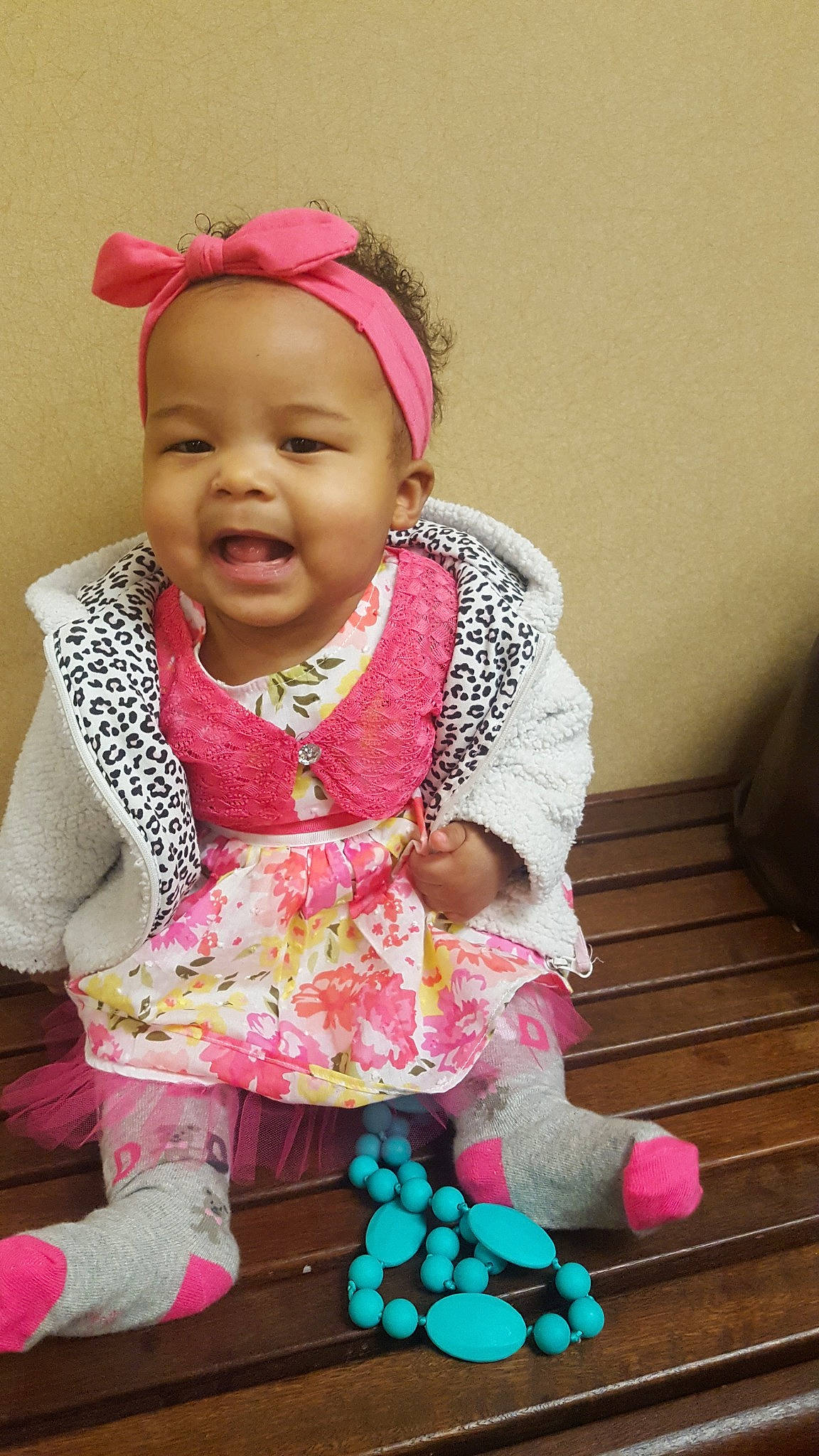 Aura is registered to the contest to win money with this photo: baby, baby_toddler_clothing, cheek, child, child_model, daughter, fashion_accessory, hair_accessory, happy, headgear, person, pink, play, sitting, skin, smile, textile, toddler