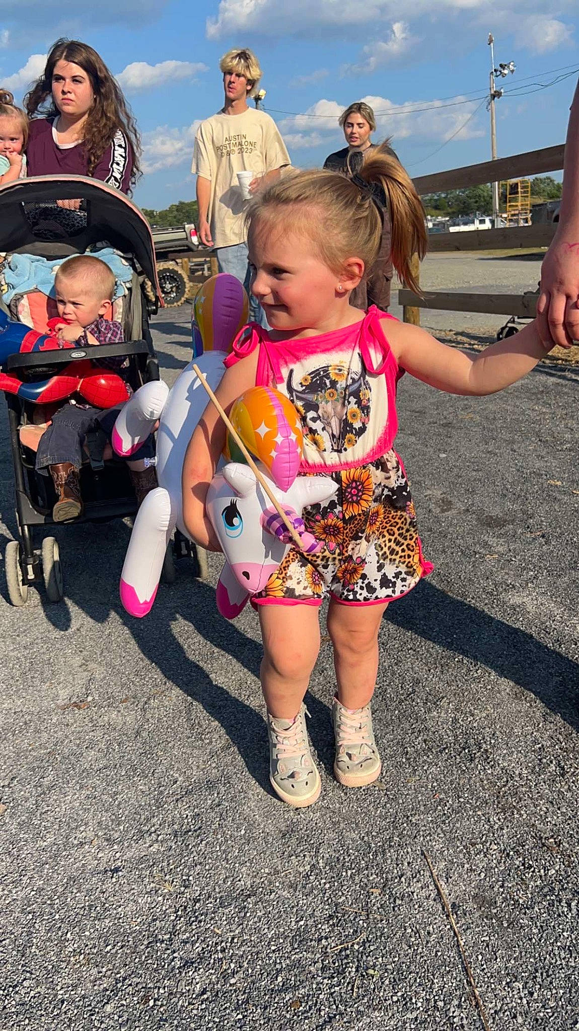 Eva joined the competition — help win amazing prizes! asphalt, boot, child, city, event, eyewear, footwear, fun, happy, leisure, pattern, person, public_event, recreation, road, sandal, sky, sneakers, toddler, vacation