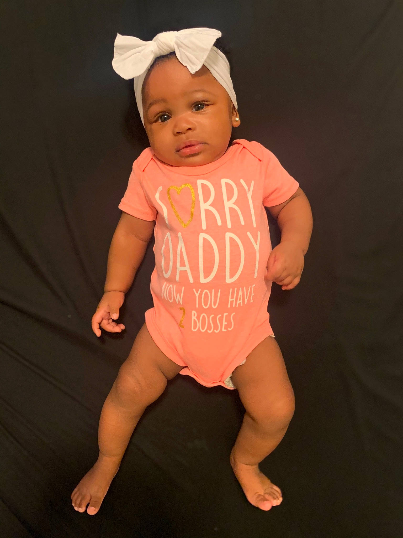 Zinovia is registered to the contest to win money with this photo: baby, baby_products, baby_toddler_clothing, child, child_model, clothing, costume, fun, head, headgear, infant_bodysuit, person, photography, pink, product, skin, sleeve, smile, t_shirt, toddler