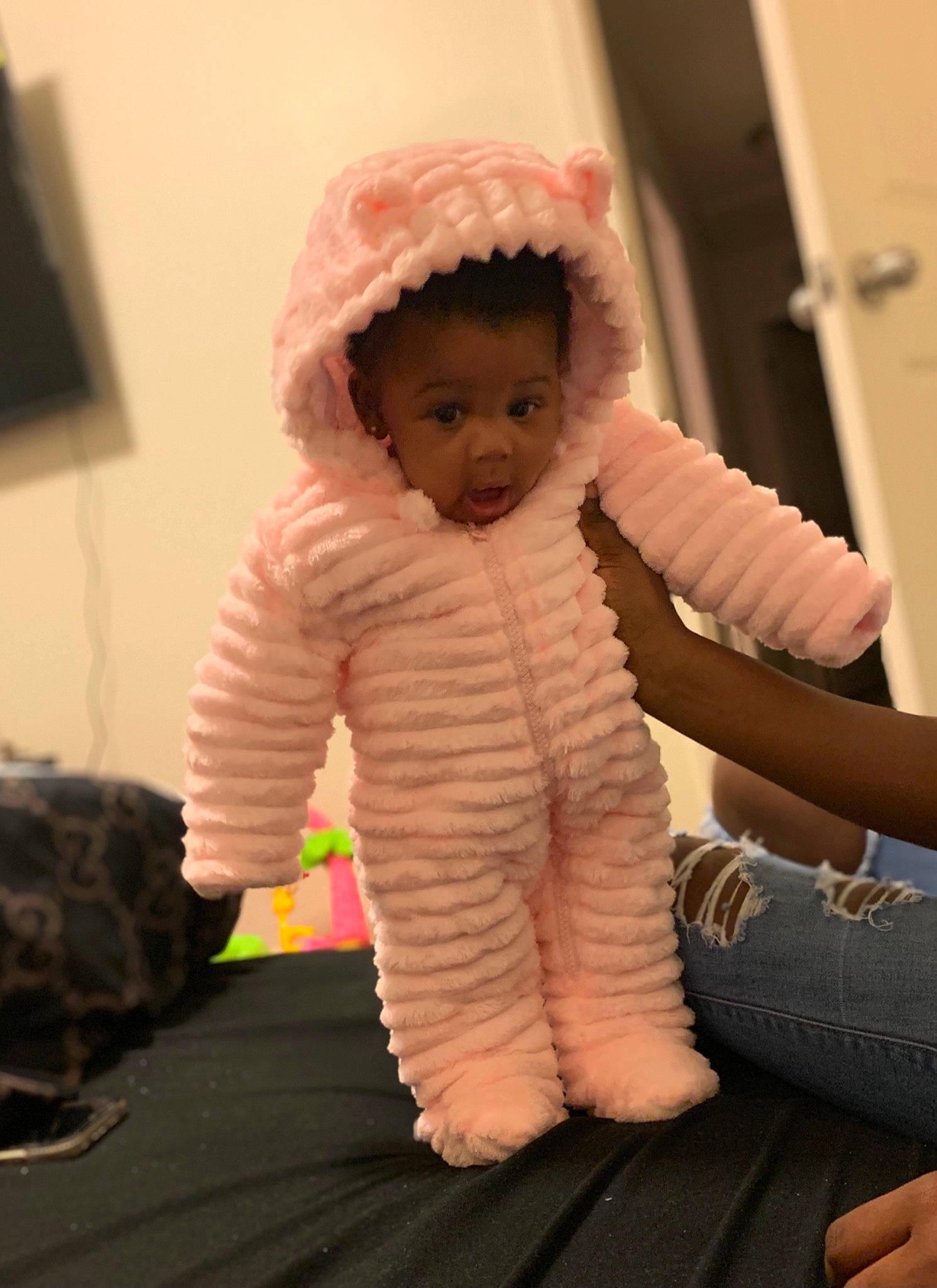 Zimoney is registered to the contest to win money with this photo: baby, baby_toddler_clothing, child, fur, headgear, outerwear, person, pink, skin, sleeve, stuffed_toy, textile, toddler, toy, wool