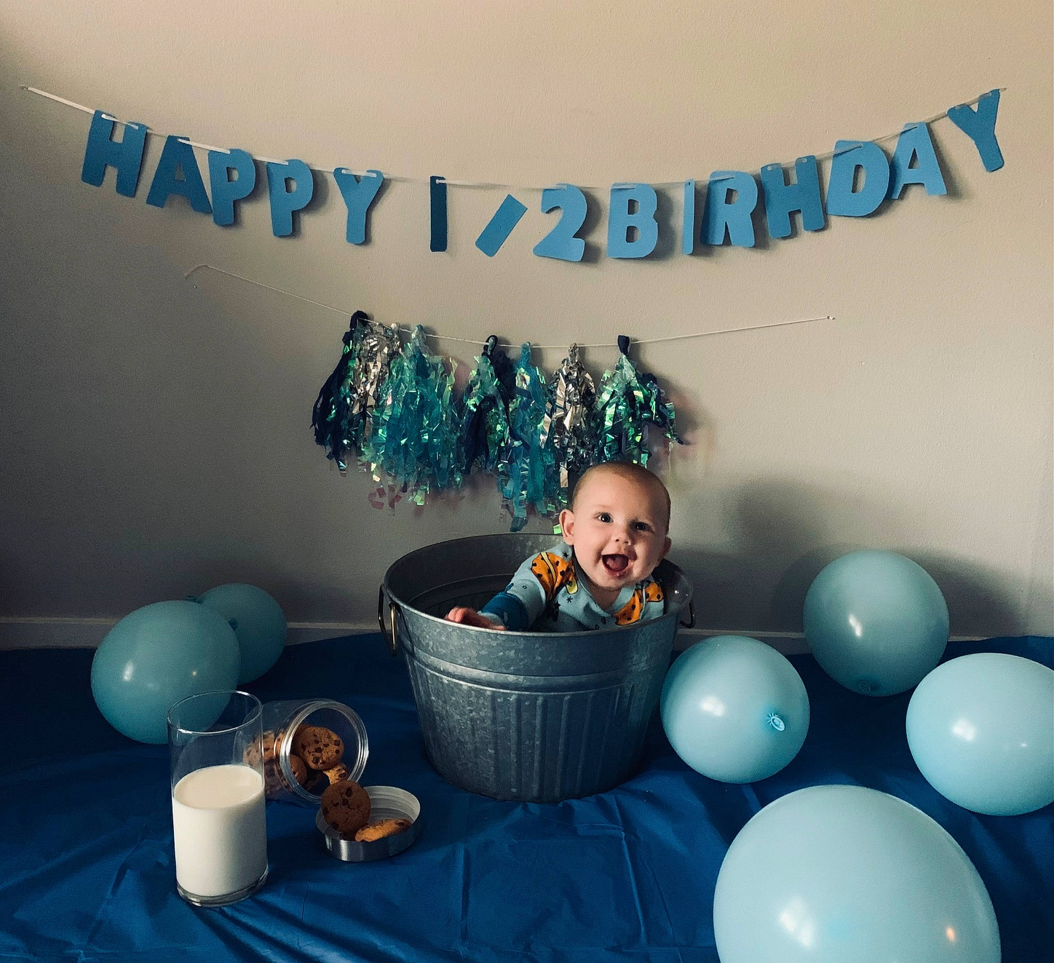 Jayson is registered to the contest to win money with this photo: aqua, azure, balloon, circle, electric_blue, event, font, fun, graphic_design, happy, illustration, party, party_supply, pattern, person, product, room, sitting, table, tableware