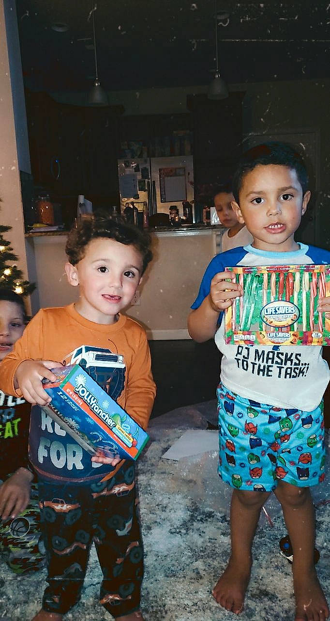 Manny is registered to the contest to win money with this photo: baby, baby_toddler_clothing, bermuda_shorts, child, christmas, christmas_decoration, christmas_eve, christmas_ornament, christmas_tree, ear, eye, head, holiday, iris, joy, mouth, nightwear, nose, ornament, pajamas