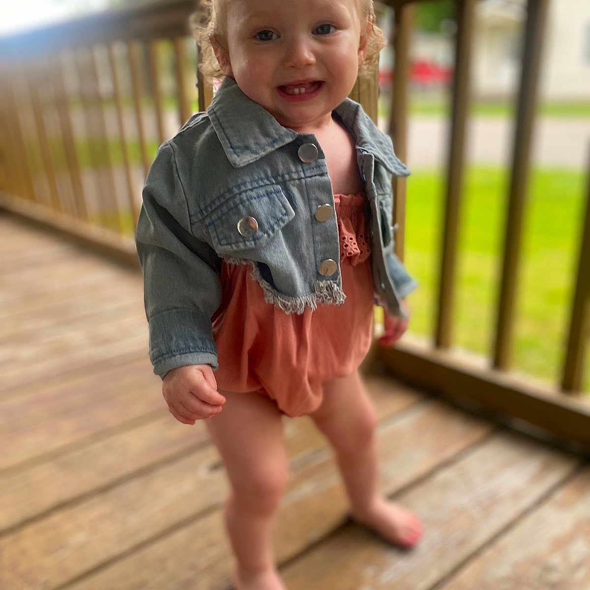 Lola is registered to the contest to win money with this photo: architecture, building, child, clothing, coat, face, female, girl, hardwood, head, house, housing, jacket, jeans, pants, person, photography, porch, portrait, wood