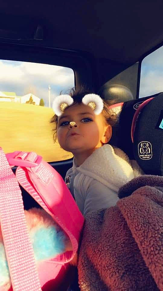 Lexie joined the competition — help win amazing prizes! black_hair, car, car_seat, child, cool, ear, fun, headwear, leisure, passenger, person, photography, pink, selfie, snapshot, toddler, vacation