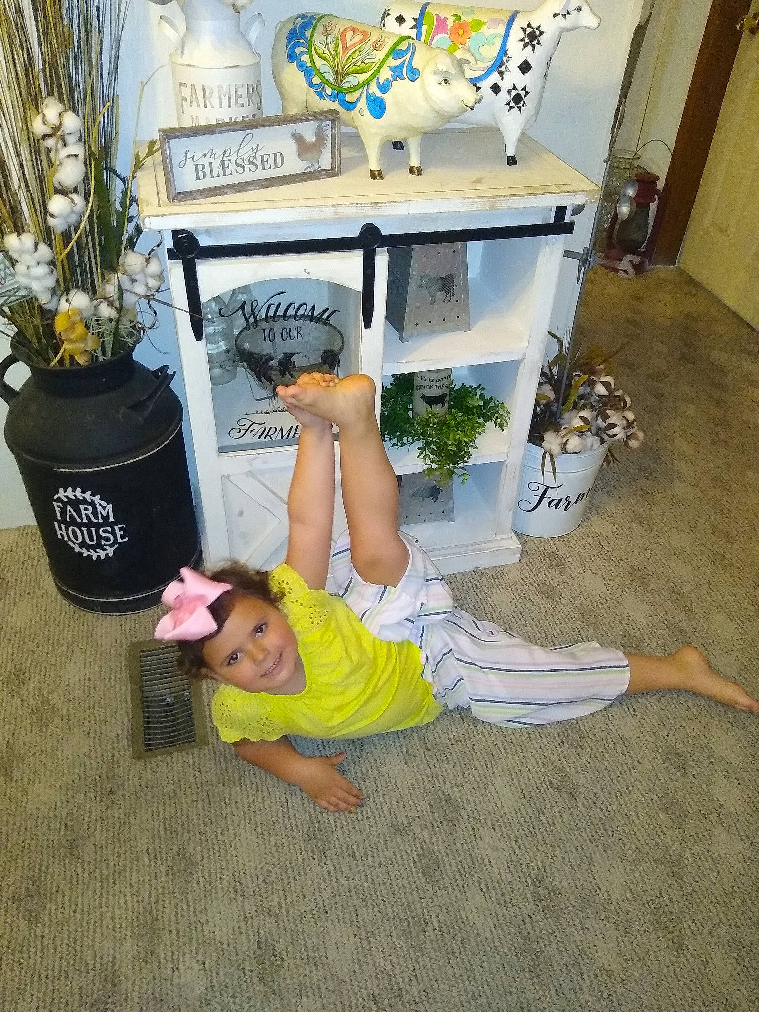 Lexie is registered to the contest to win money with this photo: child, floor, flooring, joy, leg, person, room
