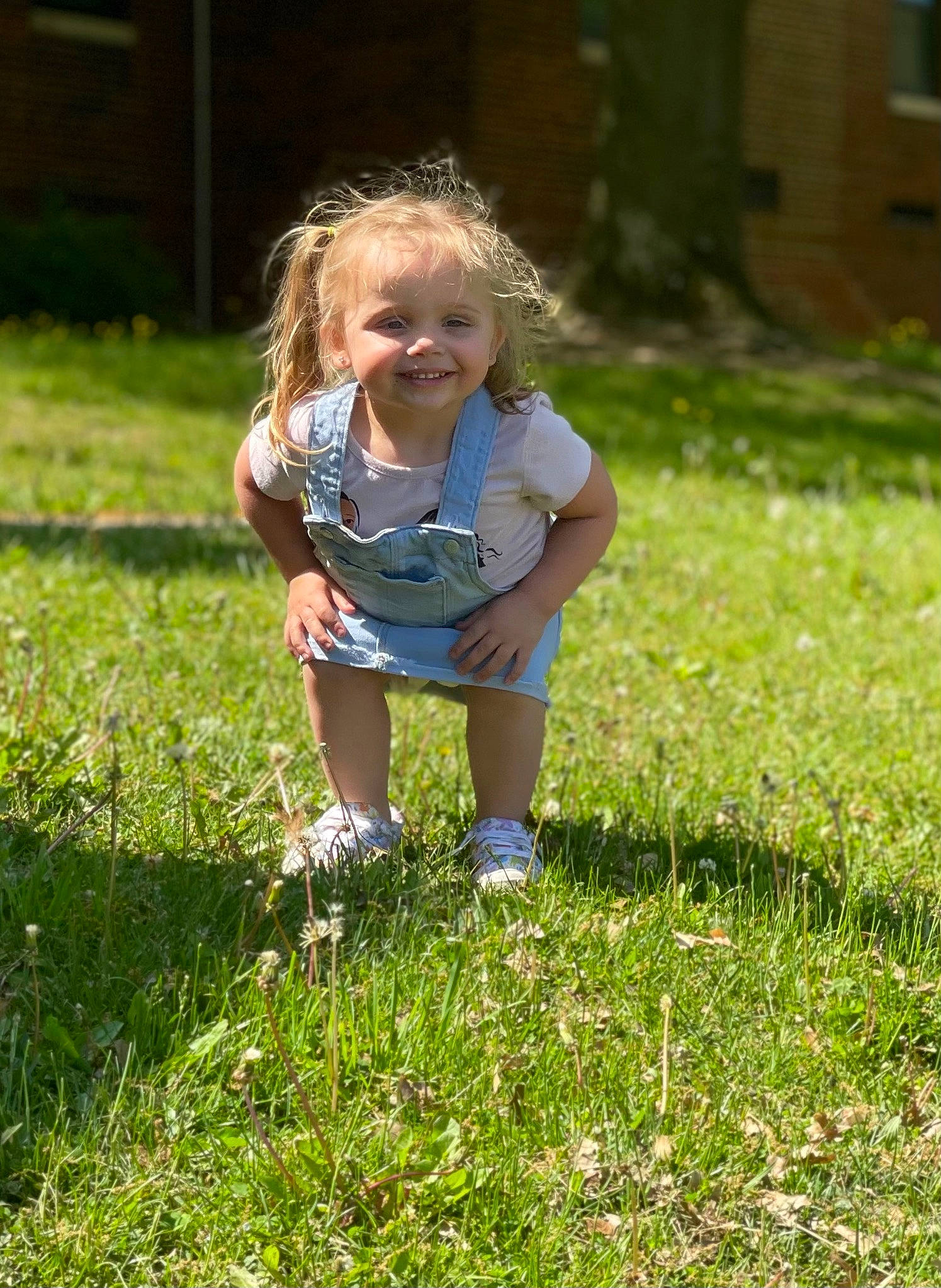 Haisley is registered to the contest to win money with this photo: child, electric_blue, fun, garden, grass, grassland, groundcover, happy, human_leg, joy, lawn, leisure, meadow, natural_landscape, people_in_nature, person, plant, prairie, shorts, smile