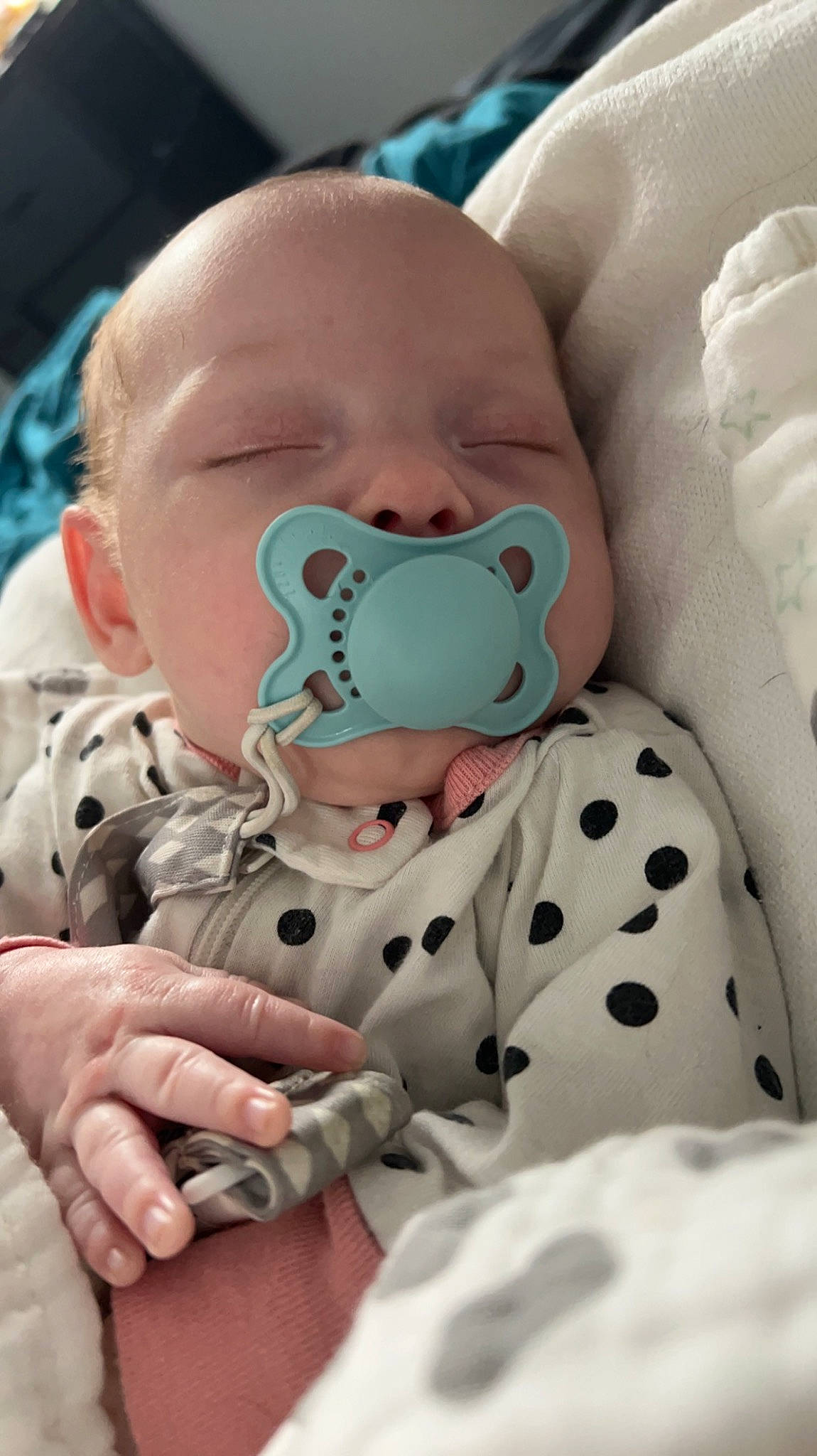 Piper is registered to the contest to win money with this photo: baby, baby_products, baby_safety, baby_sleeping, baby_toddler_clothing, cheek, child, comfort, finger, gesture, health_care, linens, mouth, pattern, person, room, skin, sleeve, textile, thumb