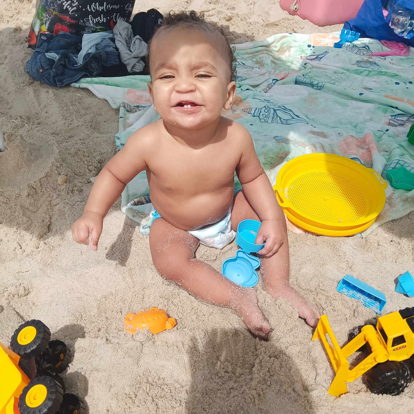 Allistaire is registered to the contest to win money with this photo: accessories, baby, bag, bodypart, device, diaper, face, finger, grass, hand, handbag, head, lawn, lawnmower, machine, person, photography, plant, portrait, wheel