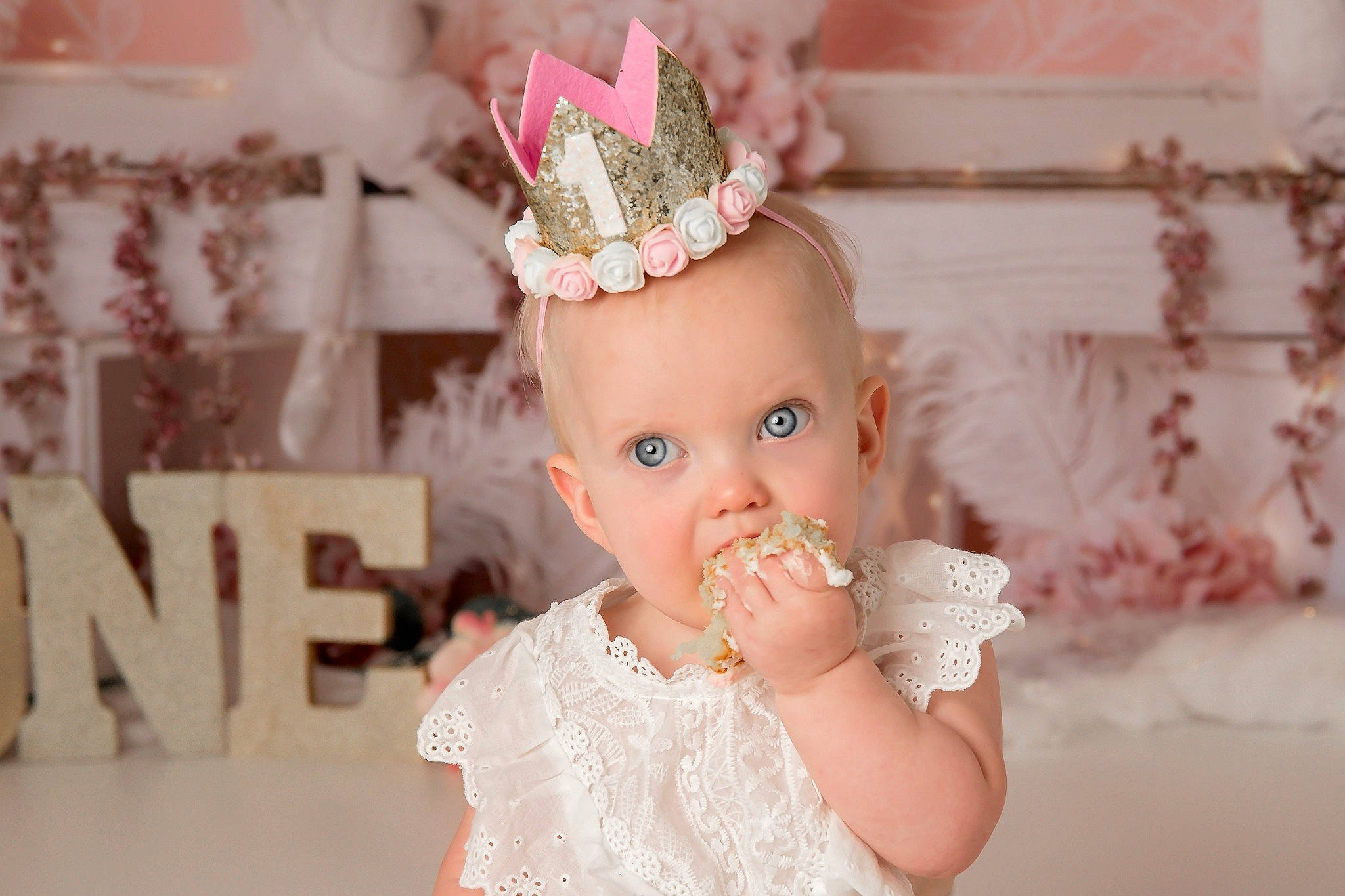 Libbie is registered to the contest to win money with this photo: baby_toddler_clothing, birthday, bridal_accessory, cake_decorating, costume_hat, dress, eyelash, gesture, happy, head, headband, headpiece, icing, jewellery, party_hat, party_supply, person, pink, tiara, toddler
