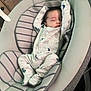 Peter is registered to the contest to win money with this photo: baby, baby_rocker, child, cozy, cushion, cute, furniture, gray, head, indoors, infant, newborn, onesie, patterned_clothing, peaceful, relaxing, resting, sleeping, soft, striped