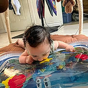 Peter joined the competition — help win amazing prizes! baby, infant, water_mat, toy, floor, indoor, curly_hair, play, colorful, child, crawling, soft_mat, plastic, fish_toy, water, exploration, cute, person, home, floor_tile