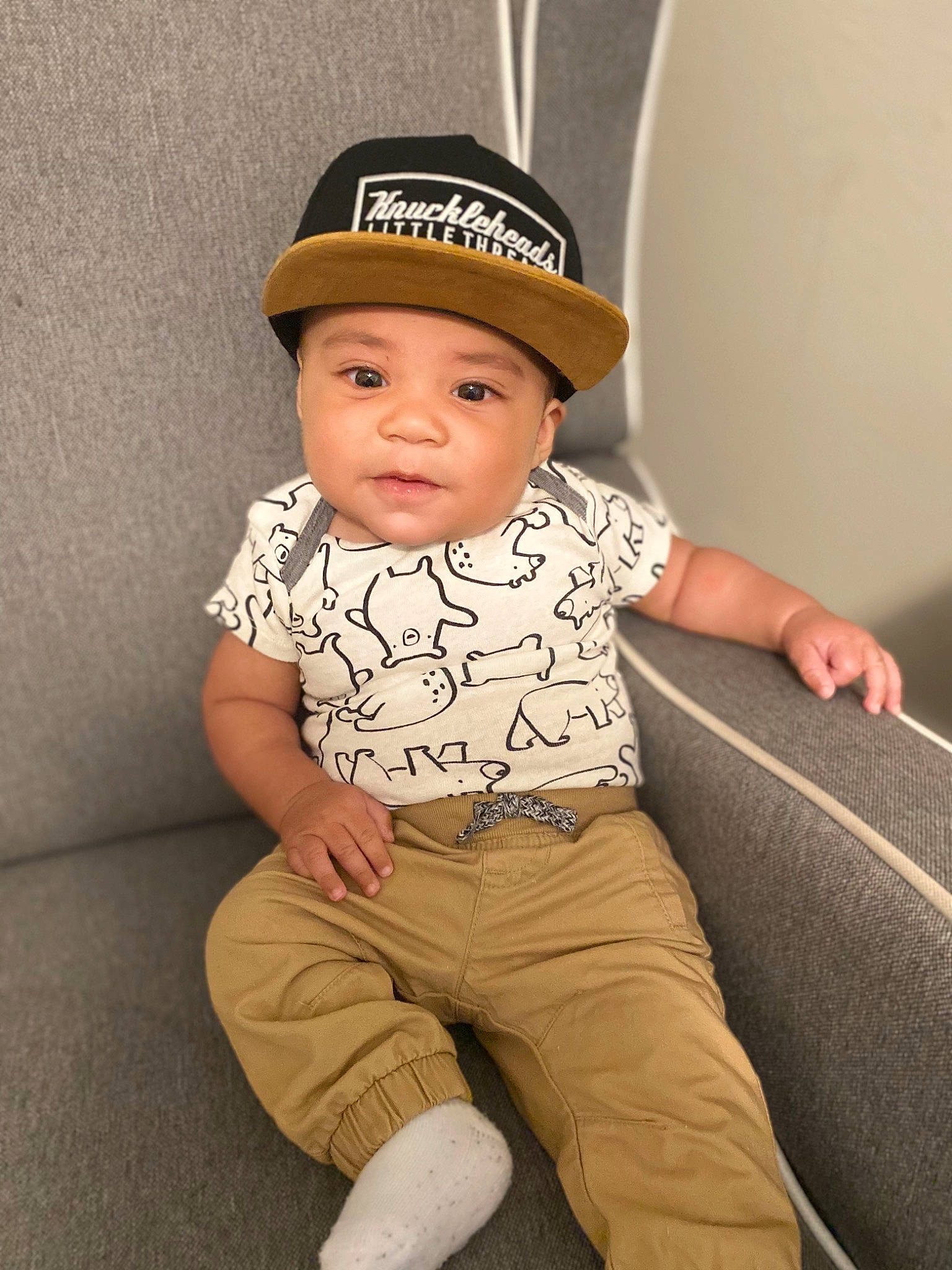 Diego joined the competition — help win amazing prizes! baby, baby_toddler_clothing, cap, child, collar, comfort, costume_hat, dress_shirt, fashion_accessory, flash_photography, happy, headgear, headwear, human_leg, knee, pattern, person, portrait_photography, sitting, sleeve