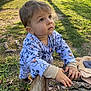 toddler, child, outdoor, grass, tree_stump, sunlight, shadow, curious, clothing, mickey_mouse, long_sleeve, nature, park, young_child, hands, face, eyes, expression, casual, daylight
