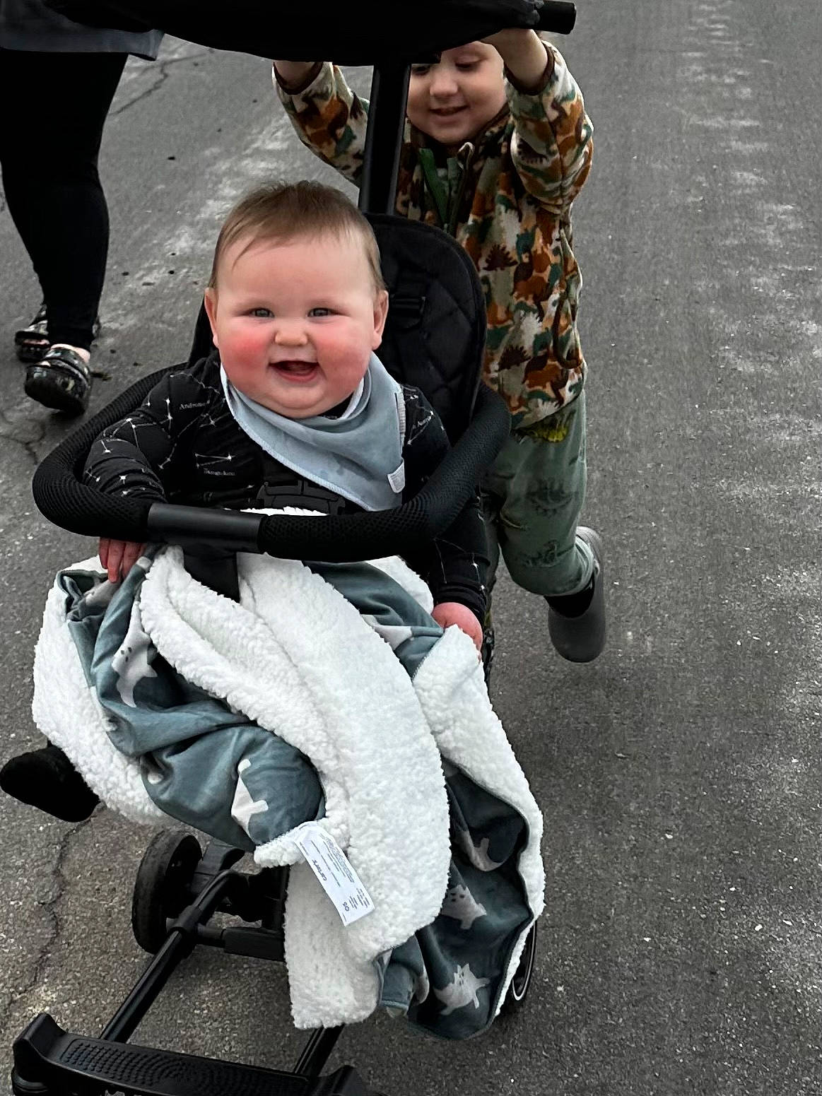 Everett joined the competition — help win amazing prizes! asphalt, auto_part, baby, baby_carriage, baby_products, baby_toddler_clothing, carmine, child, costume, face, fun, happy, headwear, joy, person, personal_protective_equipment, photograph, photography, recreation, sitting