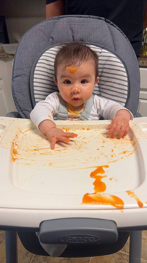 Daniela joined the competition — help win amazing prizes! baby, baby_toddler_clothing, chair, child, comfort_food, cooking, cuisine, dish, dishware, event, food, ingredient, orange, person, plate, product, recipe, sharing, t_shirt, tableware