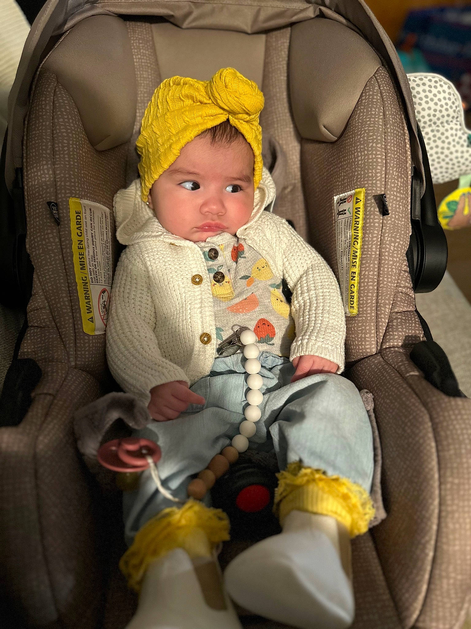 Daniela is registered to the contest to win money with this photo: auto_part, baby, baby_carriage, baby_in_car_seat, baby_products, baby_safety, baby_sleeping, baby_toddler_clothing, bag, car_seat, car_seat_cover, cheek, child, comfort, headwear, lap, person, product, seat_belt, sitting