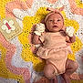 Daisy-Mae joined the competition — help win amazing prizes! baby, infant, newborn, pink_clothing, headband, mittens, crocheted_blanket, pastel_colors, one_month, lying_down, hand, soft_texture, patterned_blanket, cute, small, child, portrait, indoor, warm_colors, peaceful