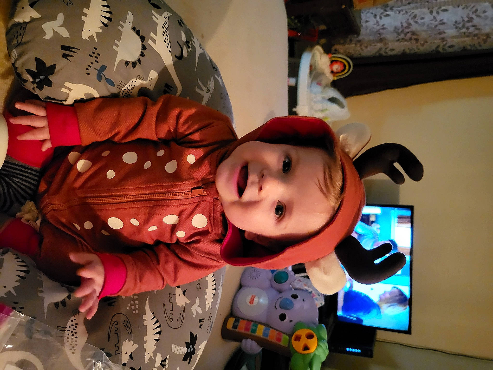 Emmerson is registered to the contest to win money with this photo: animation, art, baby, cap, child, costume, display_device, event, fictional_character, fun, gadget, headwear, led_backlit_lcd_display, multimedia, pattern, person, room, smile, snapshot, space