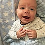 Keegan is registered to the contest to win money with this photo: baby, infant, smile, face, hands, blanket, clothing, dots, cozy, soft, texture, pattern, star_pattern, happy, cute, child, portrait, indoor, newborn, warm