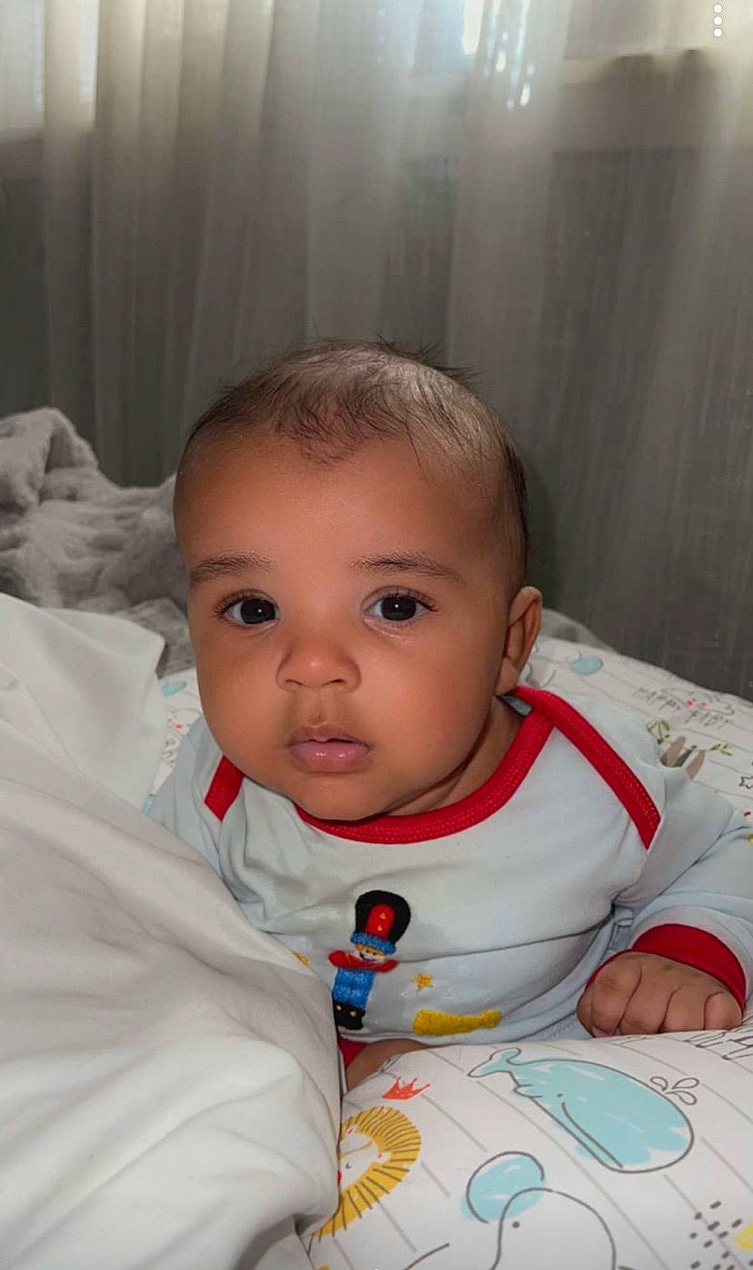 Kylen is registered to the contest to win money with this photo: baby, baby_toddler_clothing, bib, cheek, chin, comfort, eyelash, forehead, happy, iris, linens, lip, mouth, nose, person, skin, sleeve, smile, textile, toddler