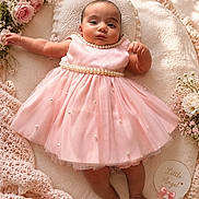 Myra is registered to the contest to win money with this photo: adorable, baby, blanket, child, closeup, cozy, cute, decorative_bow, flowers, gentle_lighting, head_support, infant, innocence, lying_down, nursery, pearls, pink_dress, portrait, soft_texture, toddler
