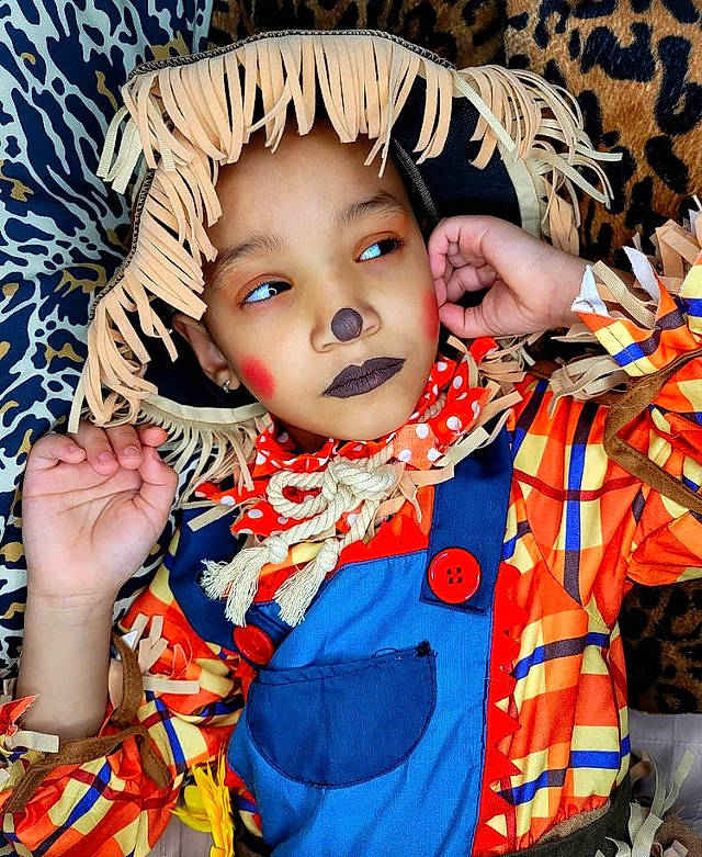 Jazlynn is registered to the contest to win money with this photo: baby, baby_toddler_clothing, costume, costume_accessory, embellishment, eye, headwear, orange, overall, person