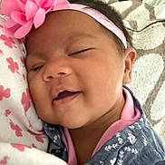 Serenity joined the competition — help win amazing prizes! baby, infant, sleeping, yawning, flower_headband, pink, portrait, close_up, face, smiling, bed, blanket, floral_pattern, clothing, denim, headband, indoors, cuddled, peaceful, photography