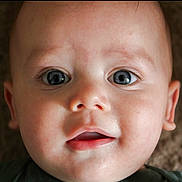 Cooper joined the competition — help win amazing prizes! baby, close_up, face, blue_eyes, infant, child, portrait, skin, expression, curious, soft_light, lying_down, head, mouth, person, young, innocence, background_blur, human, cute