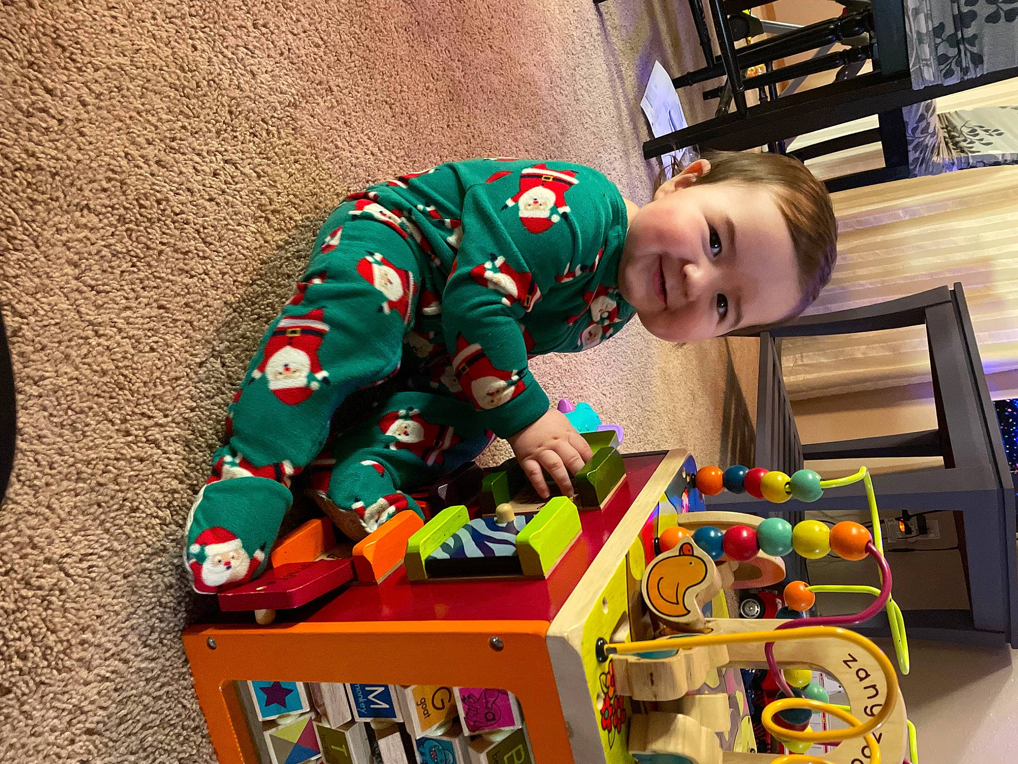 Ellis joined the competition — help win amazing prizes! baby, baby_toddler_clothing, baby_toys, box, cart, child, flooring, fun, happy, holiday, joy, person, plastic, play, room, shelving, sitting, toddler, toy, toy_vehicle