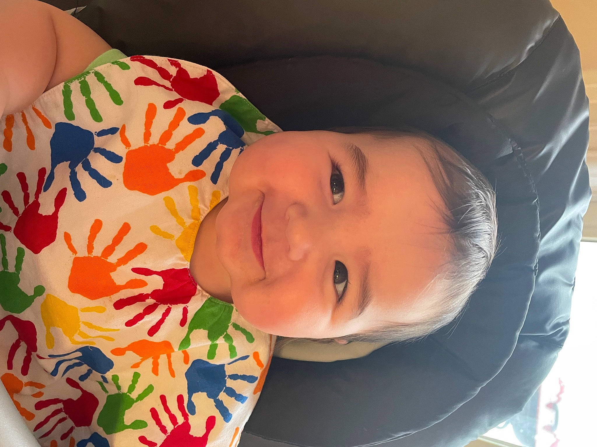 Ellis is registered to the contest to win money with this photo: baby, baby_laughing, baby_toddler_clothing, cheek, child, eye, glasses, happy, head, human, joy, lip, mouth, neck, nose, orange, organ, person, skin, smile