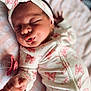 newborn, baby, sleeping, onesie, headband, pink, bow, pacifier, blanket, closeup, infant, peaceful, cute, soft, cozy, hand, face, clothing, portrait, indoor
