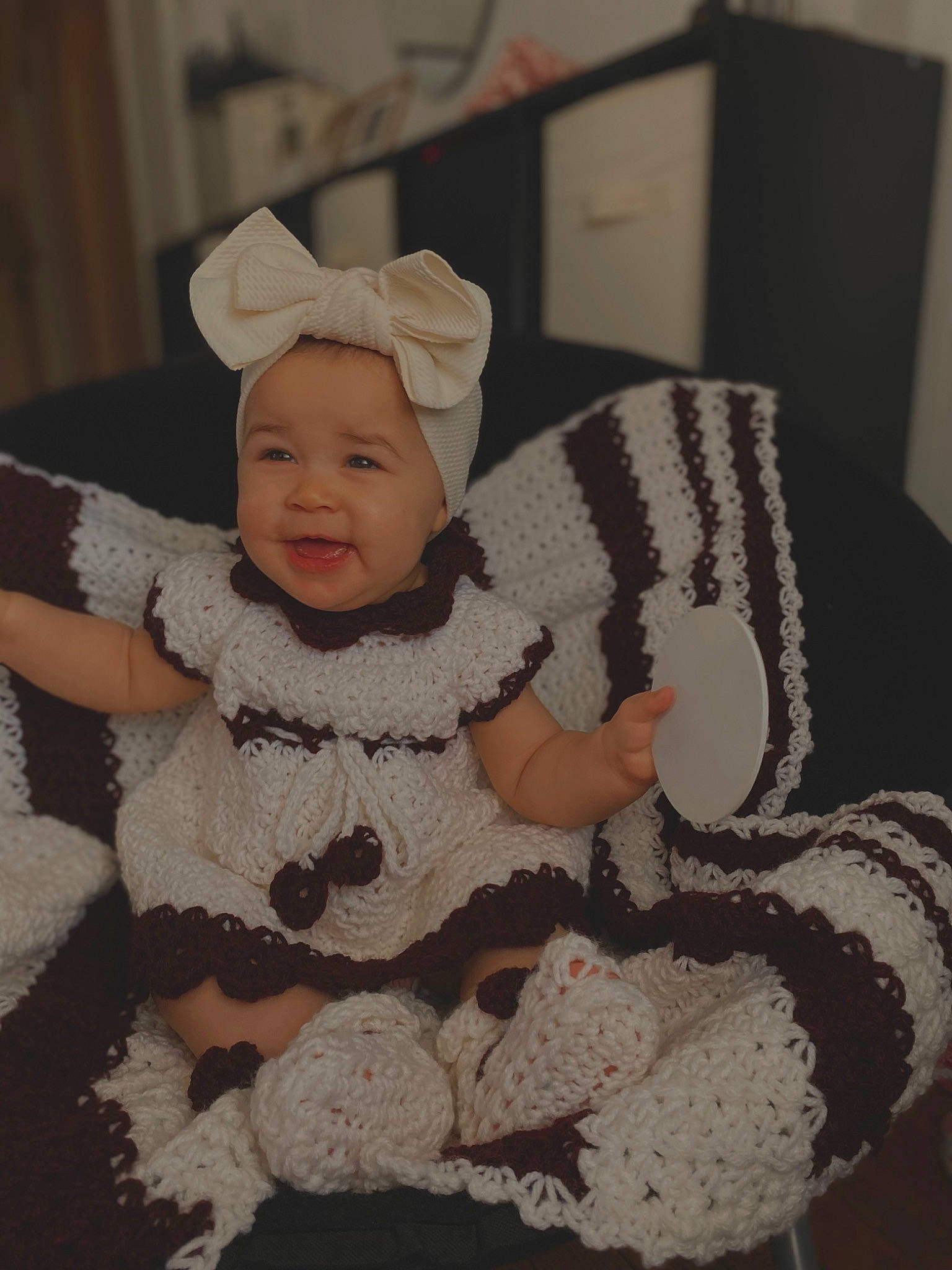 Amerie Rose is registered to the contest to win money with this photo: art, baby, baby_products, baby_toddler_clothing, cheek, child, comfort, costume_hat, eye, fur, happy, headwear, pattern, person, room, sitting, skin, sleeve, smile, toddler