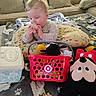 Mateo joined the competition — help win amazing prizes! baby, child, toy, plush_toy, mickey_mouse, basket, cushion, blanket, sofa, indoor, floor, chewing, clothing, person, infant, cute, home, playtime, stuffed_animal, soft_toy