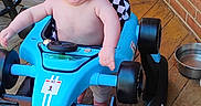 Mateo joined the competition — help win amazing prizes! baby, baby_joy, blue_toy_car, brick_wall, candid, child, face, hair, hands, happy, infant, metal_bowl, outdoor, person, playtime, seat, smiling, toy, wheels, wooden_deck