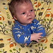 Mateo joined the competition — help win amazing prizes! baby, infant, child, blue_onesie, shark_pattern, pillow, animal_print, fox, hedgehog, owl, cute, indoors, portrait, sitting, toddler, face, expression, clothing, soft_fabric, young_child