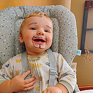 Mattie joined the competition — help win amazing prizes! baby, infant, child, smiling, laughing, portrait, high_chair, safety_straps, indoor, home, face, eyes, hair, marker_drawing, mustache, goatee, onesie, seated, playful, happy