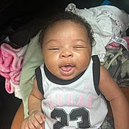 Ava Marie joined the competition — help win amazing prizes! baby, bodypart, bonnet, clothing, cushion, face, furniture, happy, hat, head, homedecor, laughing, mouth, newborn, person, photography, portrait, shorts, sitting, t_shirt