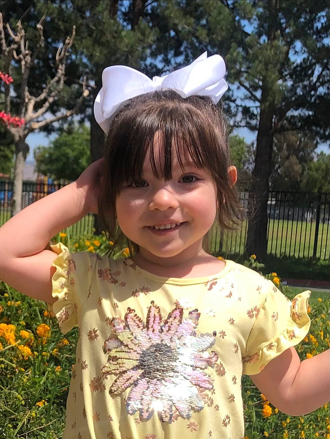 Eliana is registered to the contest to win money with this photo: botany, dress, eye, facial_expression, flower, hair, hairstyle, happy, head, human_body, joy, leaf, organ, people_in_nature, person, photograph, pink, plant, sleeve, smile