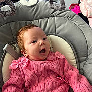 Elsie-Mae joined the competition — help win amazing prizes! baby, pink, knitted_outfit, bows, baby_seat, padded, happy, cute, infant, child, indoor, smiling, cozy, comfortable, portrait, face, head, apparel, person, young_child