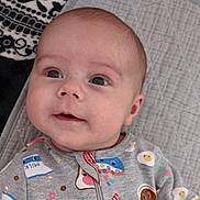 Jaxzen joined the competition — help win amazing prizes! baby, infant, onesie, clothing, face, eyes, expression, quilted_mat, blanket, skull_pattern, milk_carton_pattern, bacon_pattern, egg_pattern, cereal_pattern, indoor, portrait, cute, smiling, child, person