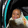 Akari is registered to the contest to win money with this photo: baby, blanket, car_seat, child, clothing, cozy, cute, face, happy, head, indoors, infant, person, portrait, seat, smiling, soft, toddler, warm, wrapped