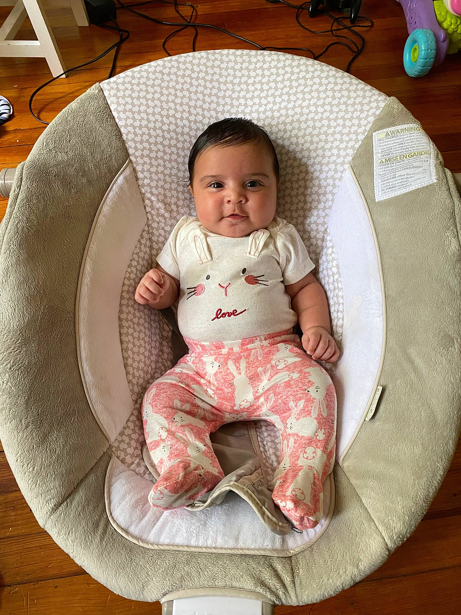 Elena is registered to the contest to win money with this photo: baby, baby_products, baby_toddler_clothing, bib, carmine, chair, child, circle, comfort, dishware, flooring, hardwood, head, lap, linens, pattern, person, sitting, sleeve, toddler